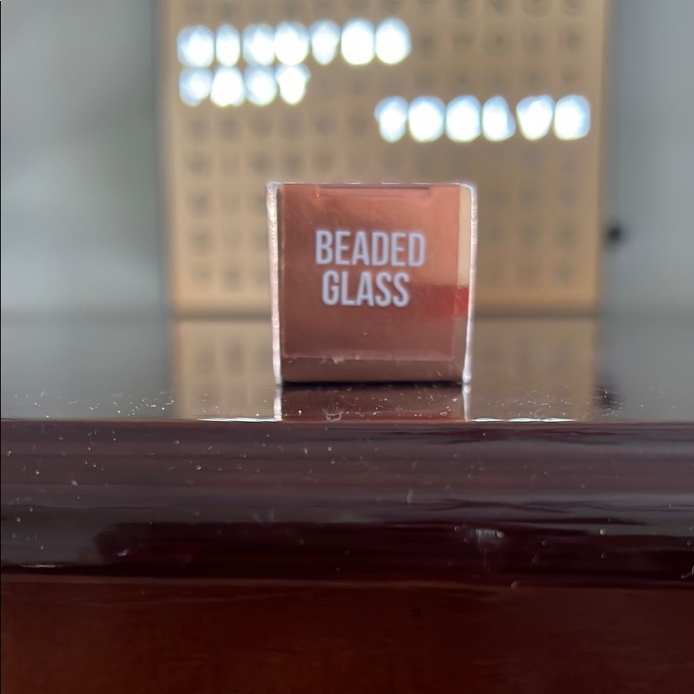 Beaded Glass Makeup Product
